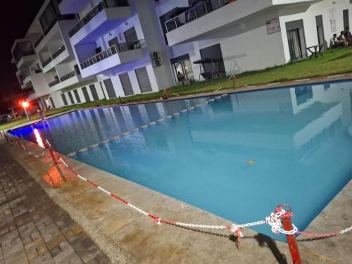 a large swimming pool with a chain around it at البحر والشمس والطبيعه in Pont Blondin