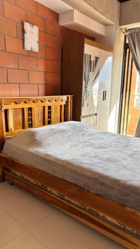Ein Bett oder Betten in einem Zimmer der Unterkunft Envigado Apartaestudio