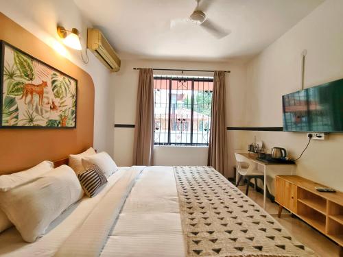 Olive Hotel Palace Road by Embassy Groupにあるテレビまたはエンターテインメントセンター