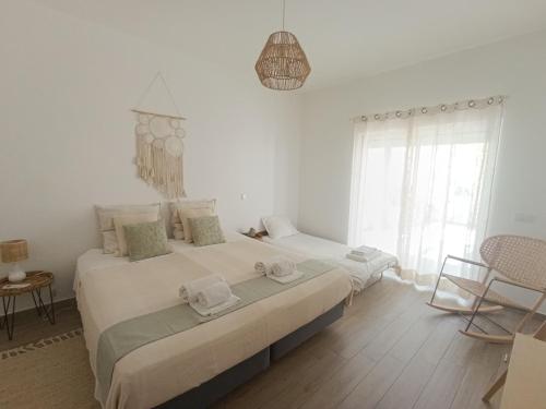 Ένα ή περισσότερα κρεβάτια σε δωμάτιο στο The Terrace House - Grémio