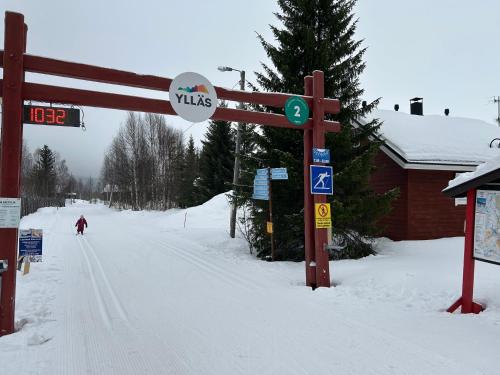 a person is skiing down a snow covered road at Yllästölli B2 in Kittilä