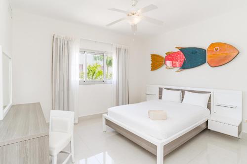Ένα ή περισσότερα κρεβάτια σε δωμάτιο στο Bakour Punta Cana Suites