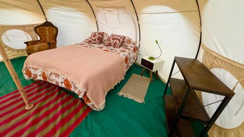 a bedroom with a bed in a tent at El Huarango Eco Lodge in La Huaica