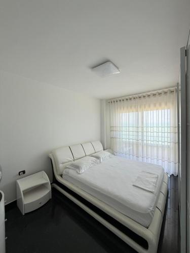 Postel nebo postele na pokoji v ubytování La Perla Rossa