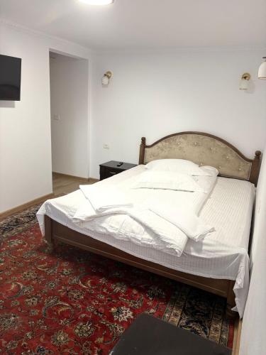 Ένα ή περισσότερα κρεβάτια σε δωμάτιο στο Casa Lazar