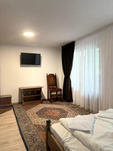 Ένα ή περισσότερα κρεβάτια σε δωμάτιο στο Casa Lazar
