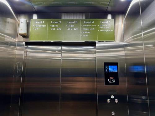 a close up of a metal elevator at Bona Ventura Hotel & Skybar in Tanjung Pinang 