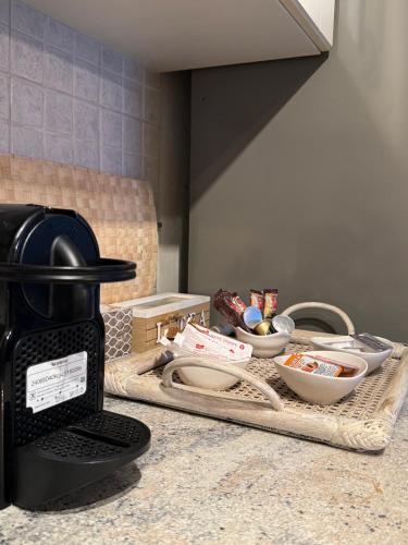 a kitchen counter with a tray of food on it at Kasteli Suite in Poros