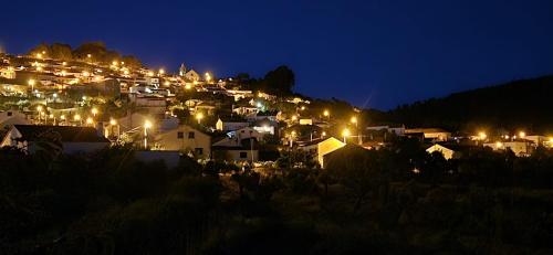 a town at night with lights on a hill at My Dream in Penha Garcia