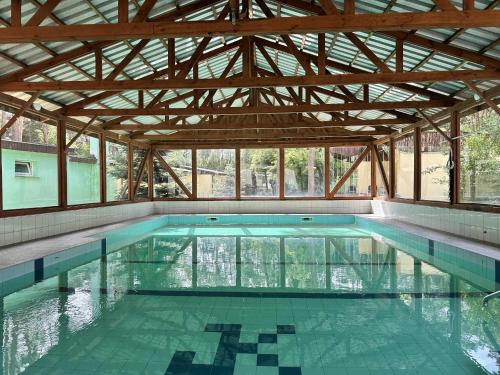 a large swimming pool with a large ceiling at U Karola in Karpicko