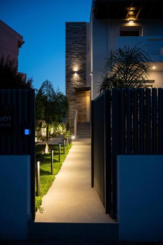 a hallway of a house with a gate and a sidewalk at Neutral Haven in Nafplio