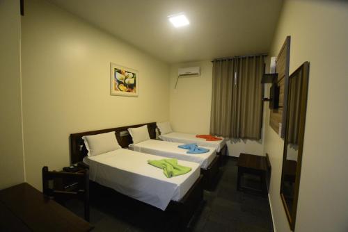 Una cama o camas en una habitación de Hotel Monte Pascoal