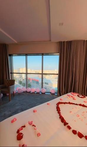 a room with a cake with red hearts on a table at Golden Season Hotel - Al-Rass - فندق جولدن سيزون - الرس in Al Rass