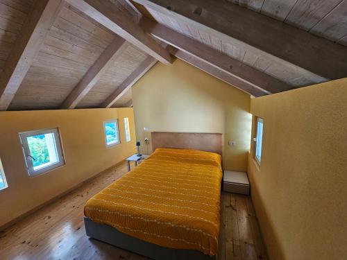 Postel nebo postele na pokoji v ubytování La casetta in collina albissola