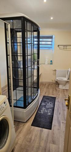 a bathroom with a cage in the middle of a room at Summer in Riga