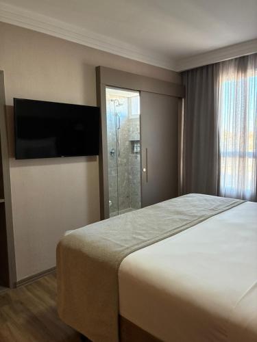 Hotel Florençaにあるベッド
