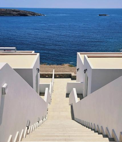 a set of stairs leading to the ocean at Aenya Kythnos Villas in Kithnos