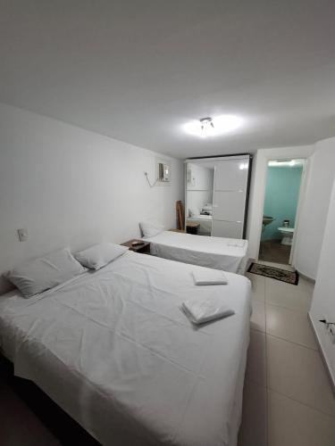Ένα ή περισσότερα κρεβάτια σε δωμάτιο στο Flat liberdade