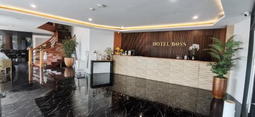 a hotel lobby with a hotel reception counter at Palette in Angeles Pampanga near Clark International Airport Formerly Boss Hotel in Angeles