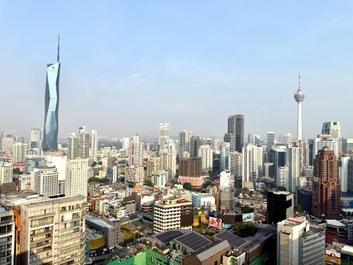 a view of a city with a lot of buildings at Luxury Axon Residence Bukit Bintang KLCC PAVILION By IZ in Kuala Lumpur