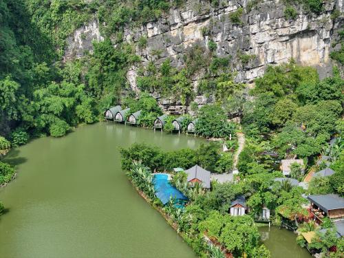 an aerial view of a river with a group of houses at Hoang Minh Mountainside Villa in Ninh Binh