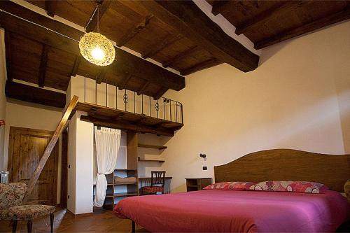 Ένα ή περισσότερα κρεβάτια σε δωμάτιο στο Agriturismo Prato Fiorito