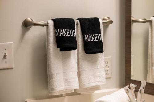 a bathroom with two towels with the words make up at Chic Escape 710 2bd Sleeps 12 Free Parking in Dallas