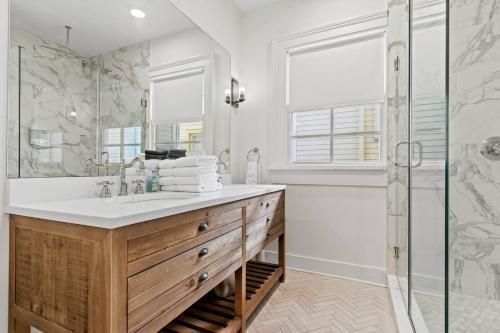 a bathroom with a sink and a shower at Magazine Street Stay Pool & Charm in New Orleans