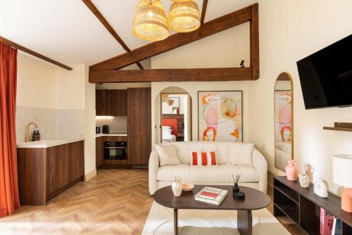 Μια τηλεόραση ή/και κέντρο ψυχαγωγίας στο Hausman Suites - Appart Hotel