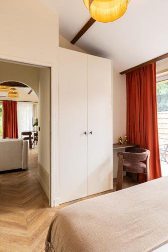 Ένα ή περισσότερα κρεβάτια σε δωμάτιο στο Hausman Suites - Appart Hotel
