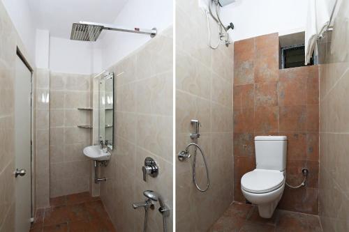 a bathroom with a toilet and a shower and a sink at Super Hotel O ABIS INN Hotel Near Dhakuria Manipal Hospital in Kolkata