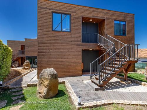 a house with a staircase in front of it at Ericeira Coxos Beach Lodge in Santo Isidoro