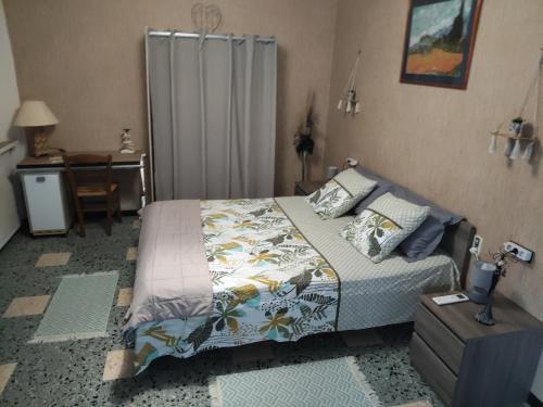 Giường trong phòng chung tại Maison du soleil