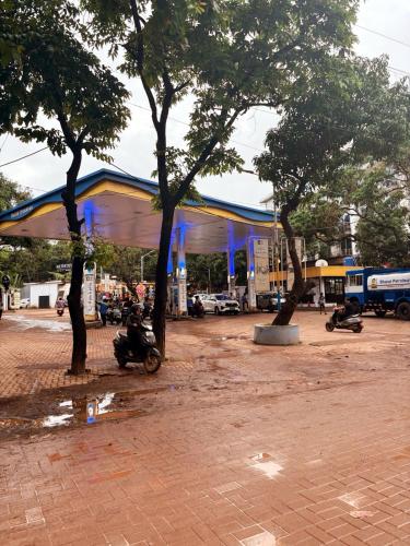 a gas station with trees in front of it at Stylish 1BHK in Vagator-Anjuna Goa in Vagator