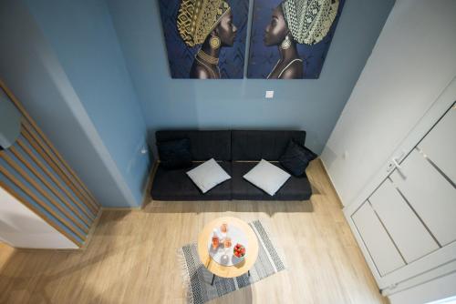 an overhead view of a living room with a couch at City house in Agios Rokkos