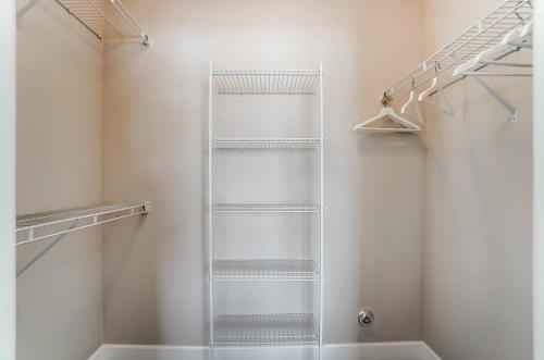 a walk in shower with a glass shelf in a bathroom at Walkable Pet-friendly 2br2ba On 1st Floor! in Westerville