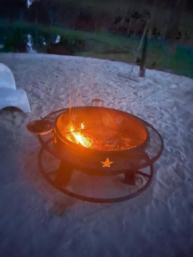 a orange frisbee sitting on top of a table at Private Farm with Beach Near St Johns River 