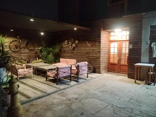 a patio with a table and chairs next to a door at Hostal Boutique Reina del Mar in Cartagena