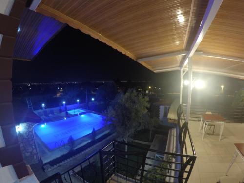 a view of a swimming pool at night at Pınar Vintage House in Pamukkale
