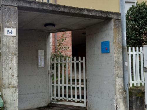 an entrance to a building with a white fence at B&B vittoria in Bazzano