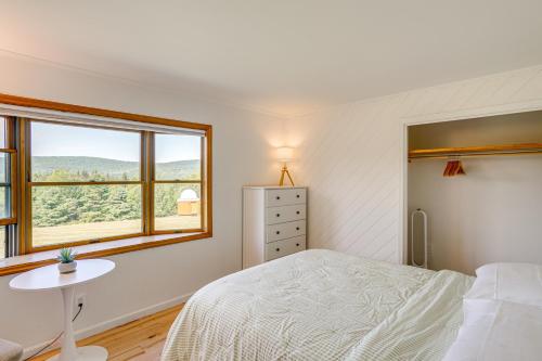 a bedroom with a bed and a table and a window at Private Hilltop Retreat Near Windham Mountain in Windham