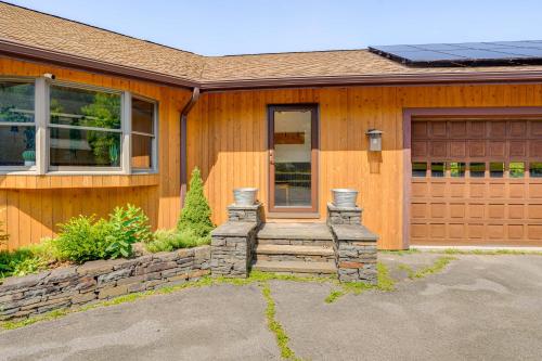 a wooden house with a garage and a driveway at Private Hilltop Retreat Near Windham Mountain in Windham