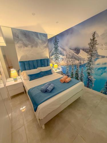 a bedroom with a large painting on the wall at Charming Madrid Apartment 6 paradas metro El Retiro in Madrid