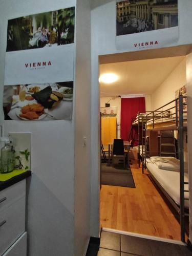 a room with two bunk beds and a hallway at ABAI Apartments 1150 only WWW-On-line-Check-in & SelfService in Vienna
