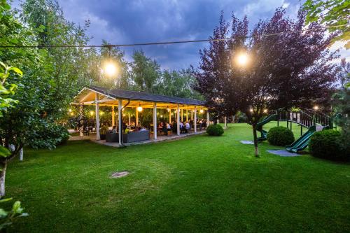 a pavilion in a park at night with lights at Armonia by Aristocratis in Tîrgu Neamţ