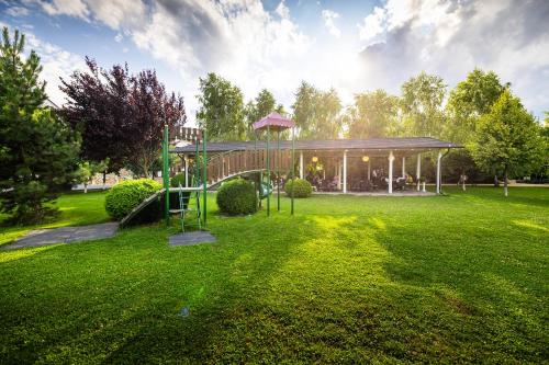 a playground in a park with a pavilion at Armonia by Aristocratis in Tîrgu Neamţ