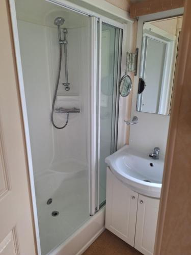 a bathroom with a shower and a sink at Wonderful views in Startforth
