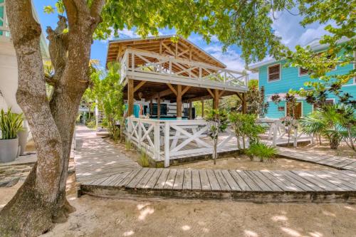 a house with a wooden porch and a blue house at Camp Bay Lodge in Camp Bay