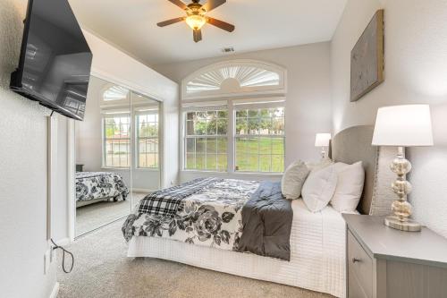 a bedroom with a bed and a window at Family Home Near Folsom Lake in El Dorado Hills! in El Dorado Hills