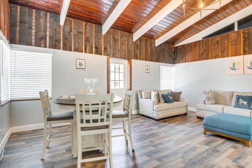 a living room with a table and chairs and a couch at Fishing Paradise Lake Poinsett Home with Deck! in Cocoa